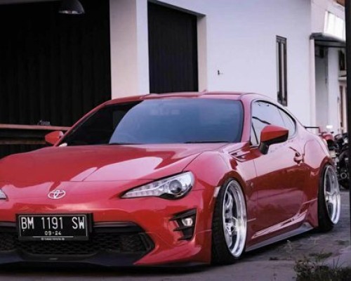 Hot and flamboyant, Toyota 86 red body modified Stance Nation style